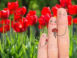 Funny picture of three fingers painted to look like a family, with mother at center