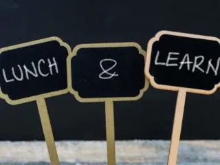 3 small signs spelling out the words Lunch and Learn