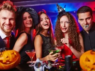 Group of young adults celebrating a Halloween birthday