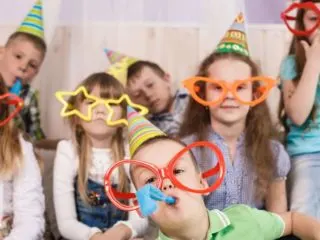 Group of goofy kids at a birthday party