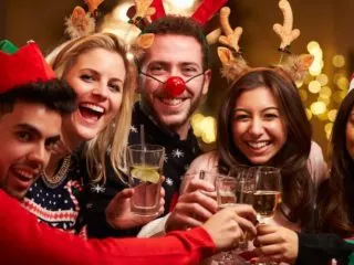 Group of 20-something friends having fun at a Christmas party