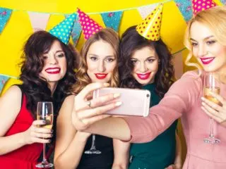 Group of young ladies taking a selfie at a 21st birthday party