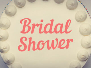 Feature image for article with bridal shower cake saying ideas